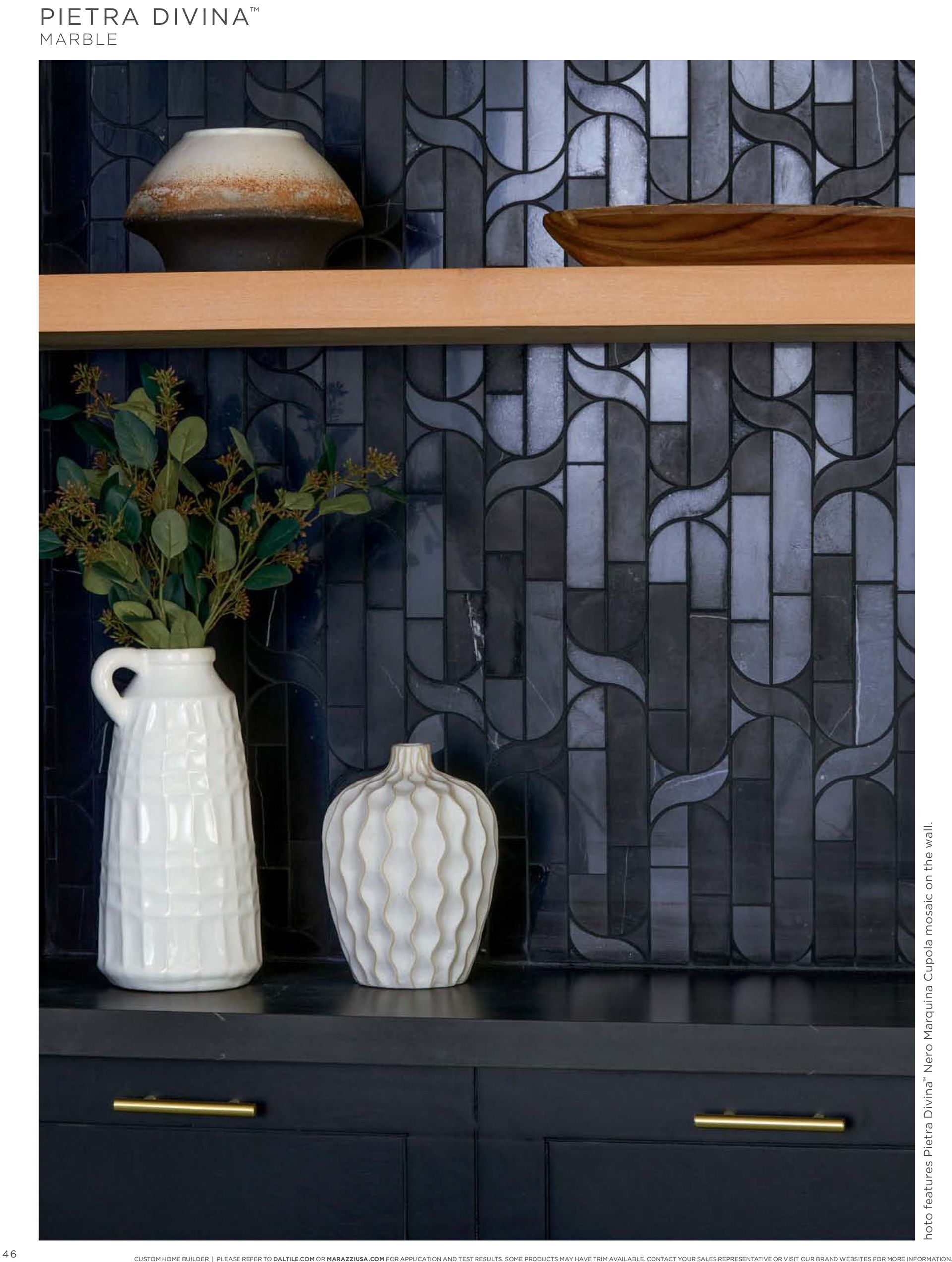 Luxury tiling | A shelf with two vases and a bowl on it.