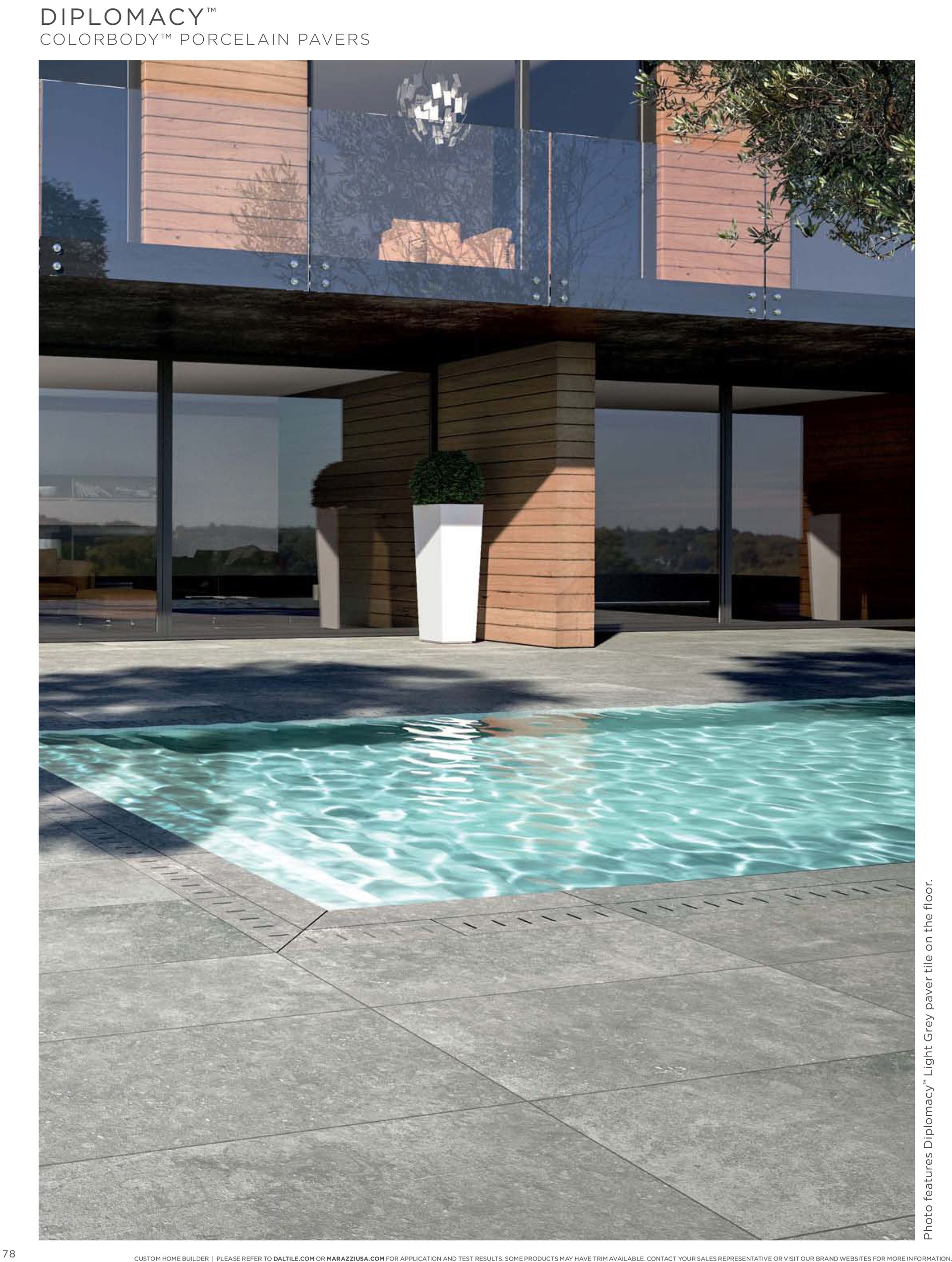 A large house with a swimming pool in front of it