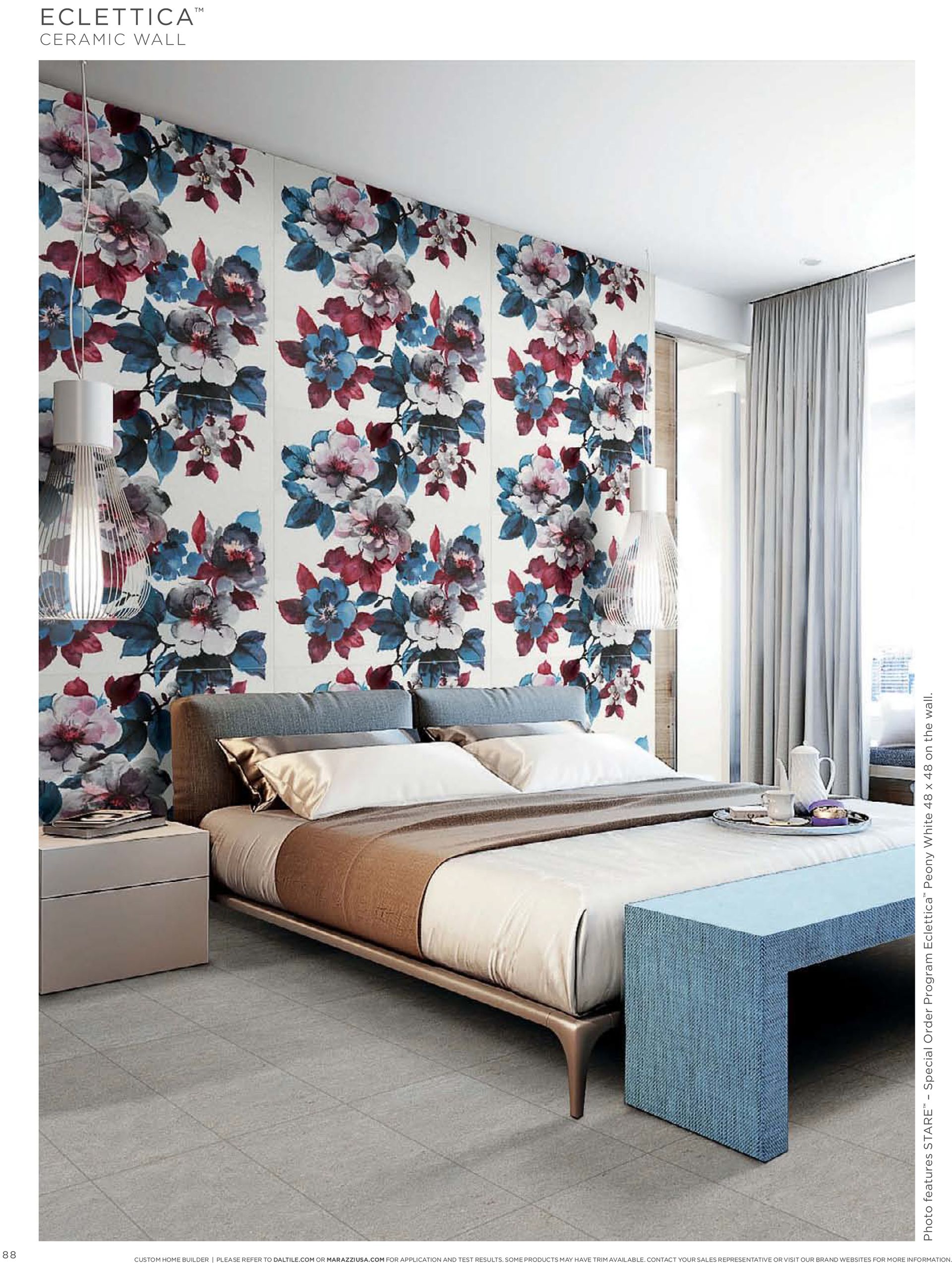 A bedroom with a large bed and a floral wallpaper on the wall