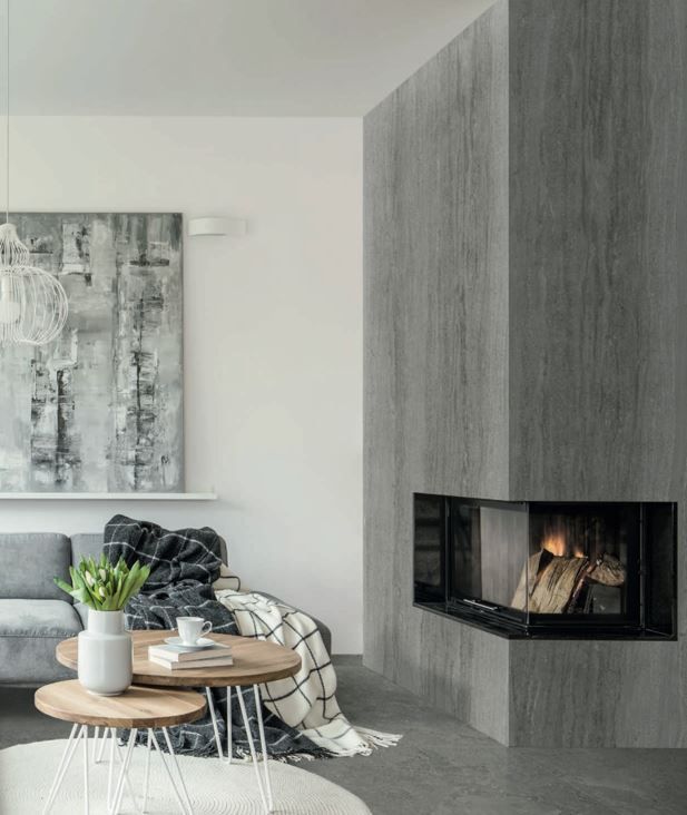 Large format tile  | A living room with a fireplace and a couch