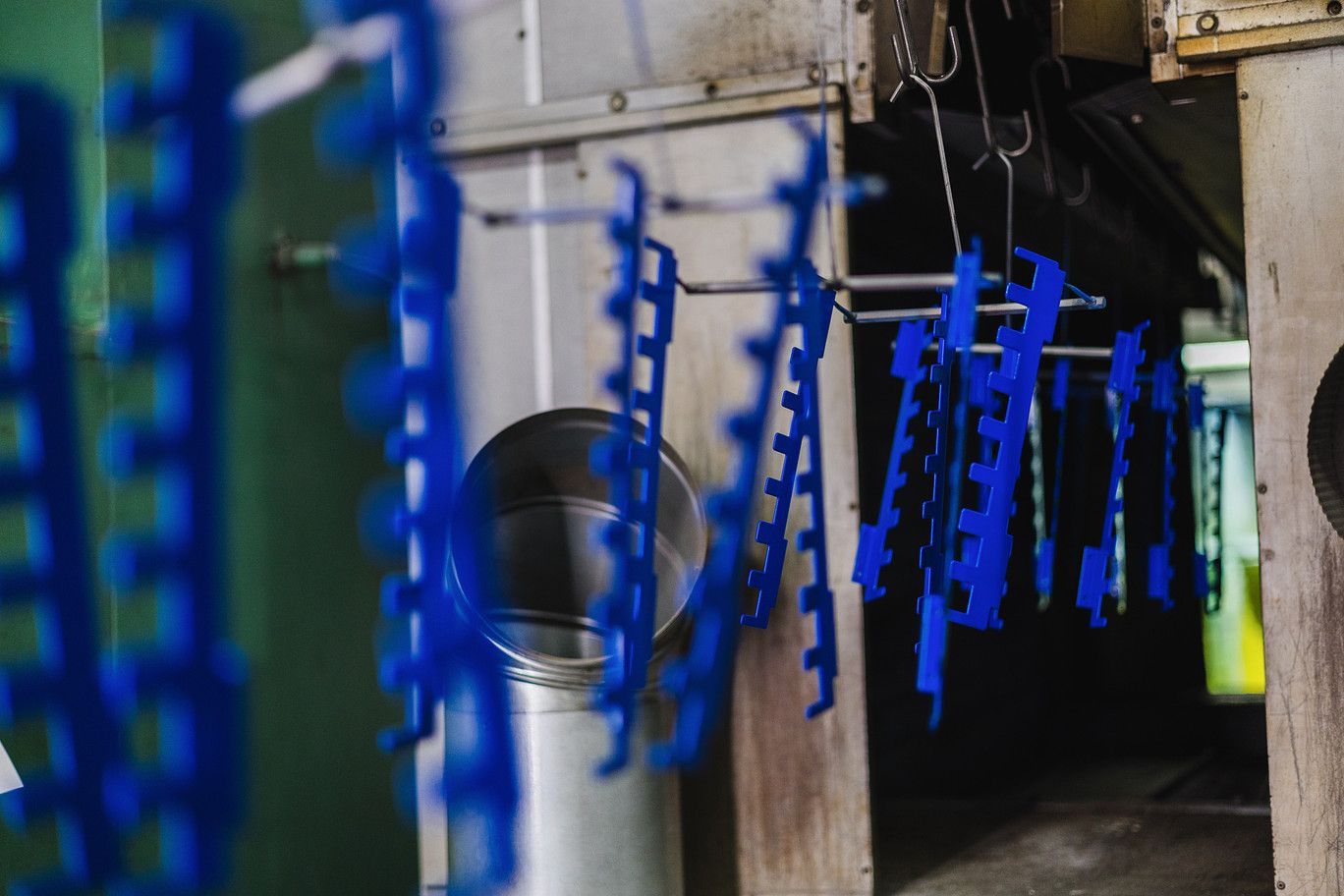 Dielectric coating protecting bus bars from electrical arcing in industrial settings