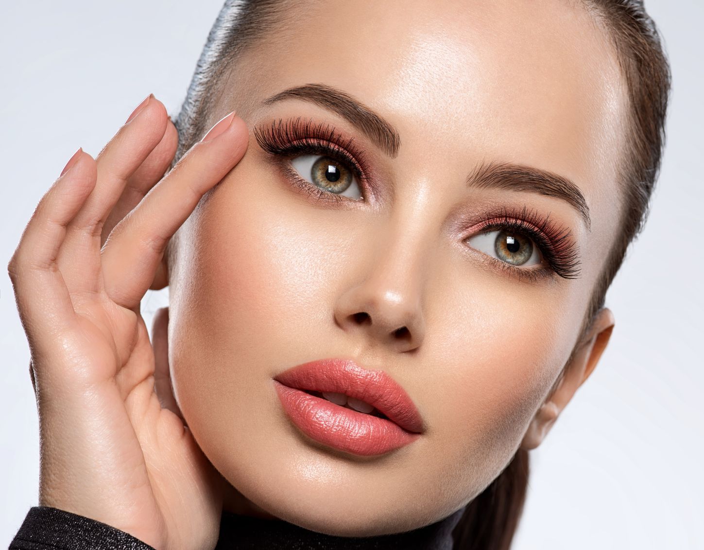 A close up of a woman 's eye with makeup on.