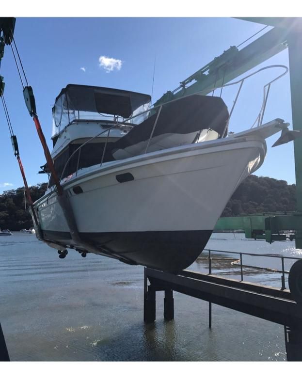 A White Boat With a Dark Hull  — Ocean Mate Marine Services in Coomera, QLD