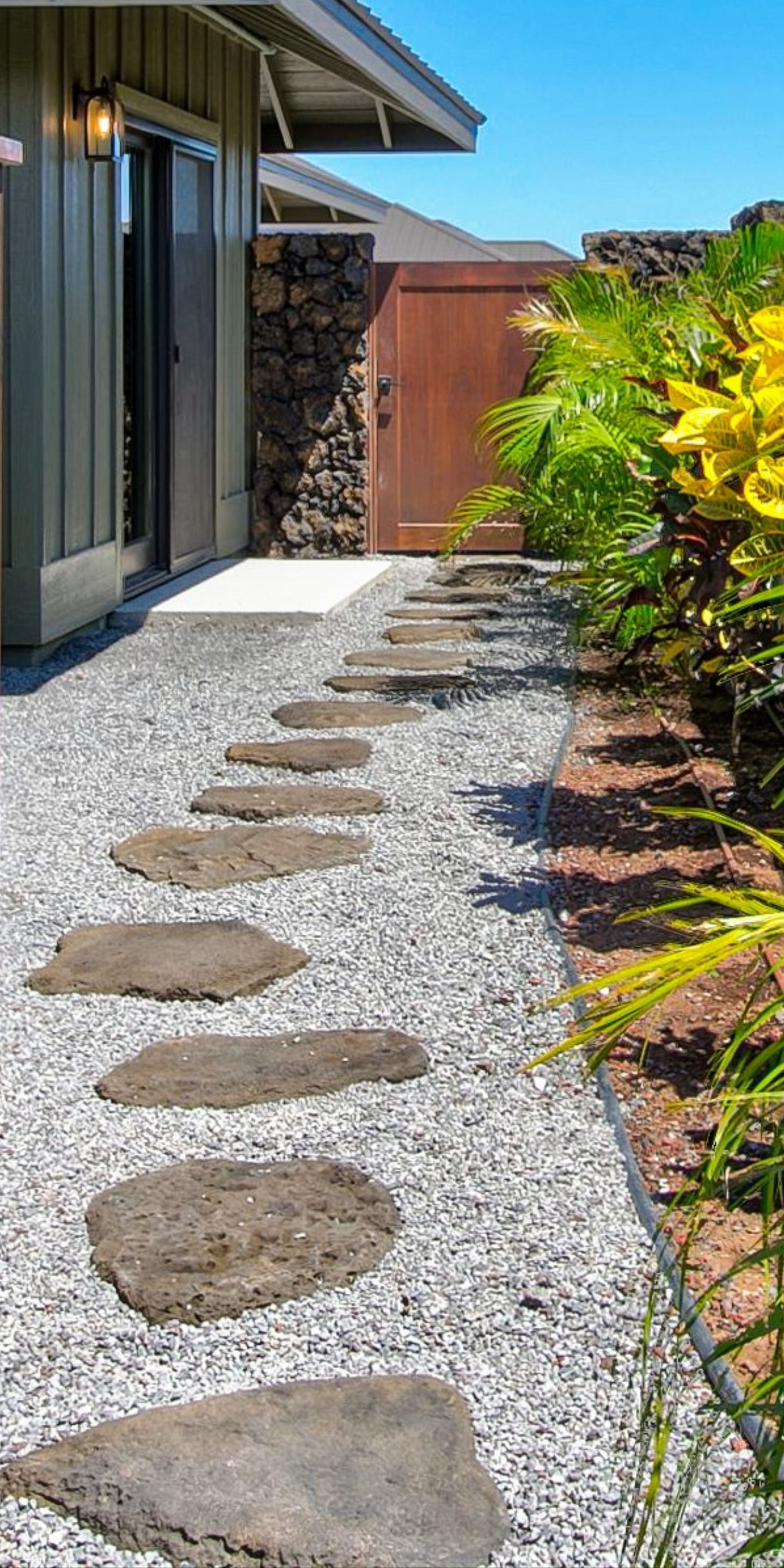 Big stepping stone being placed to make a pathway