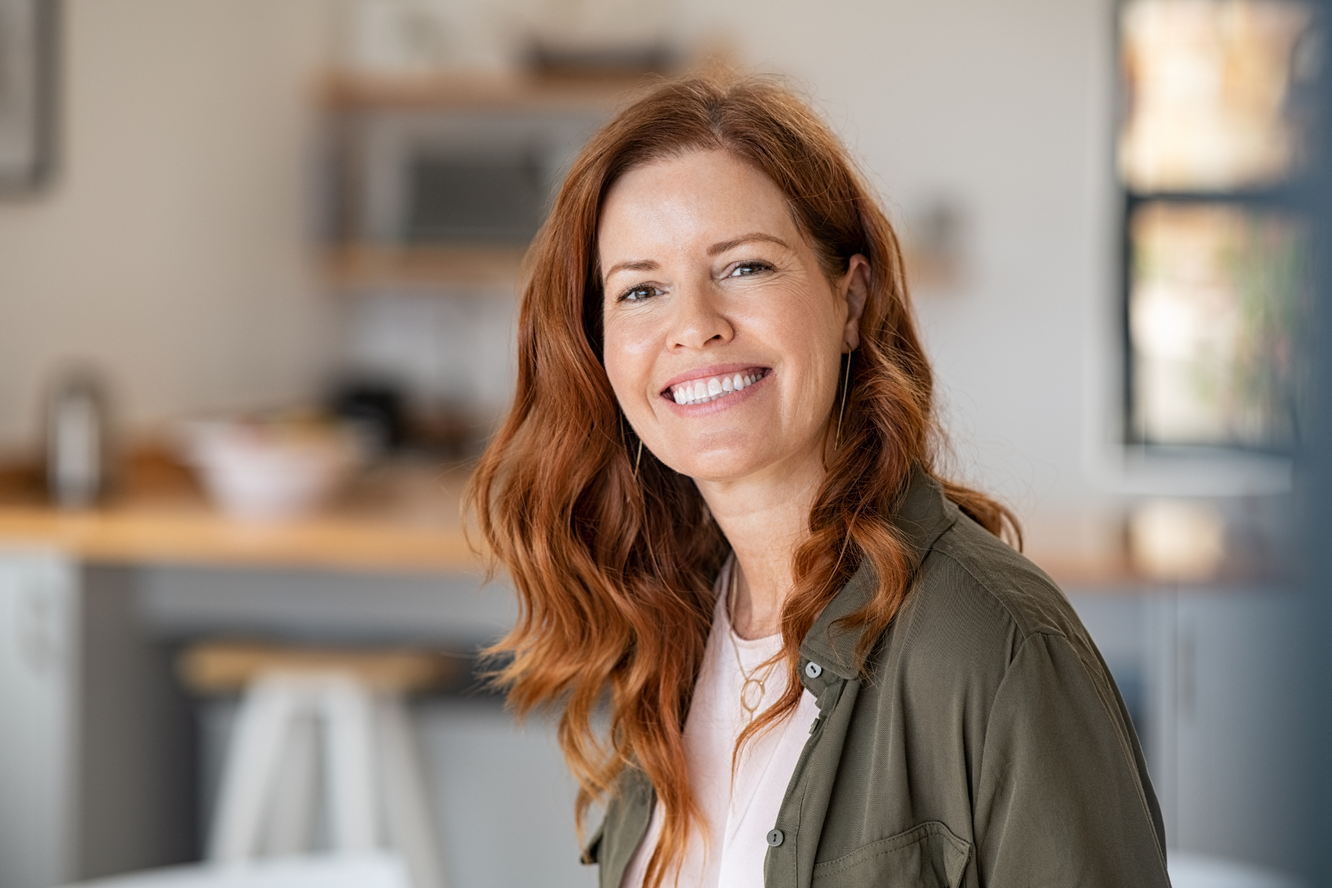 Woman with red hair in her office 