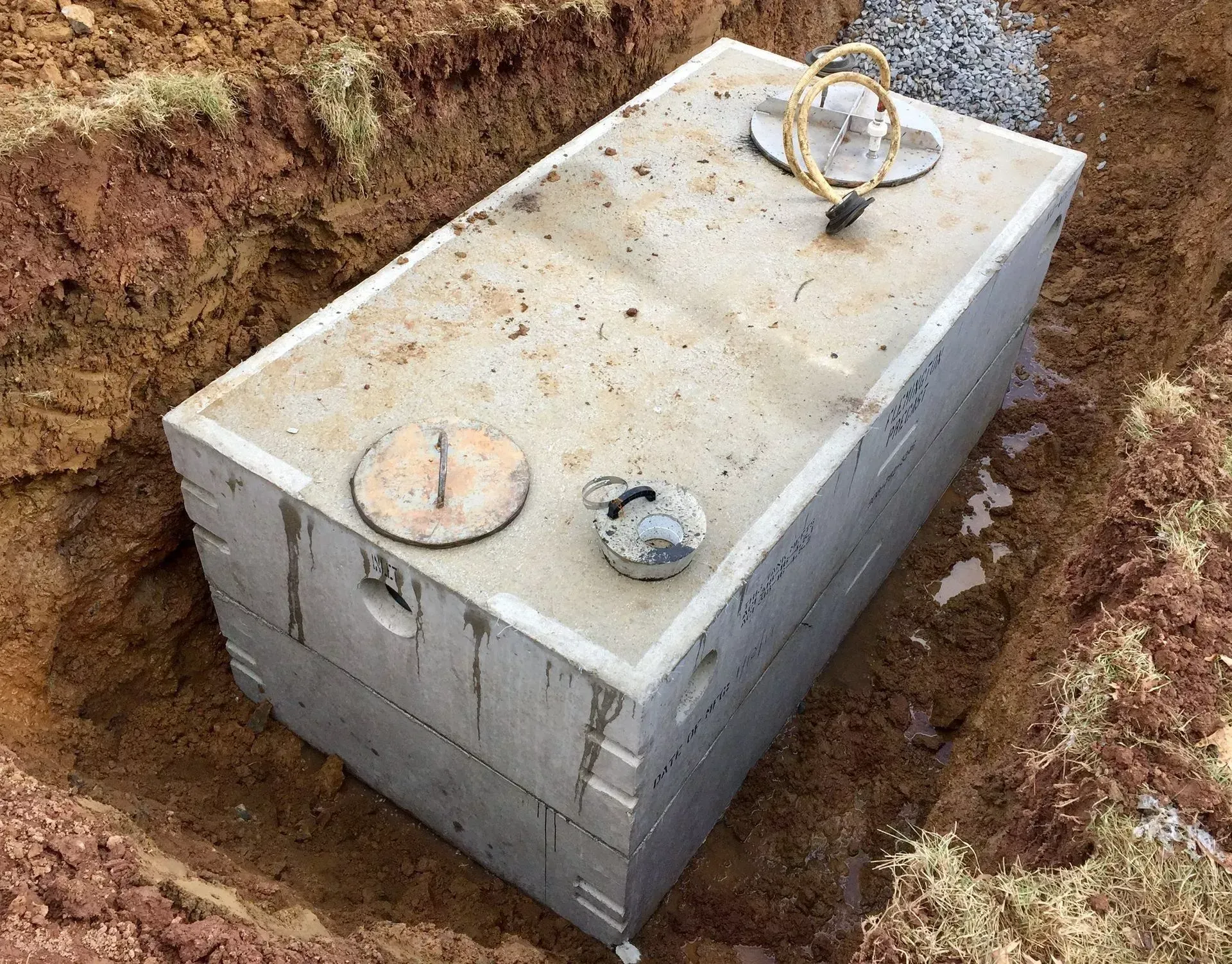 Excavated septic tank during a cleanout service performed by Top Grade Plumbing in Bakersfield CA