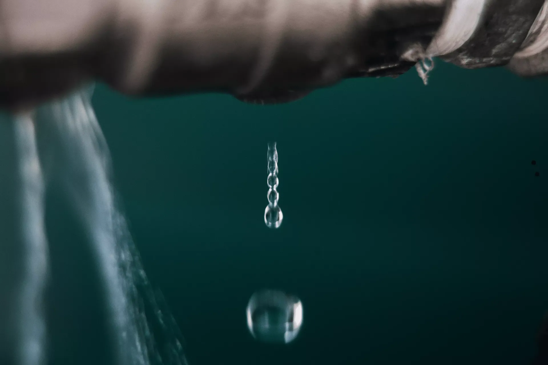Water dripping from a pipe showing signs of a hidden water leak in a Bakersfield home