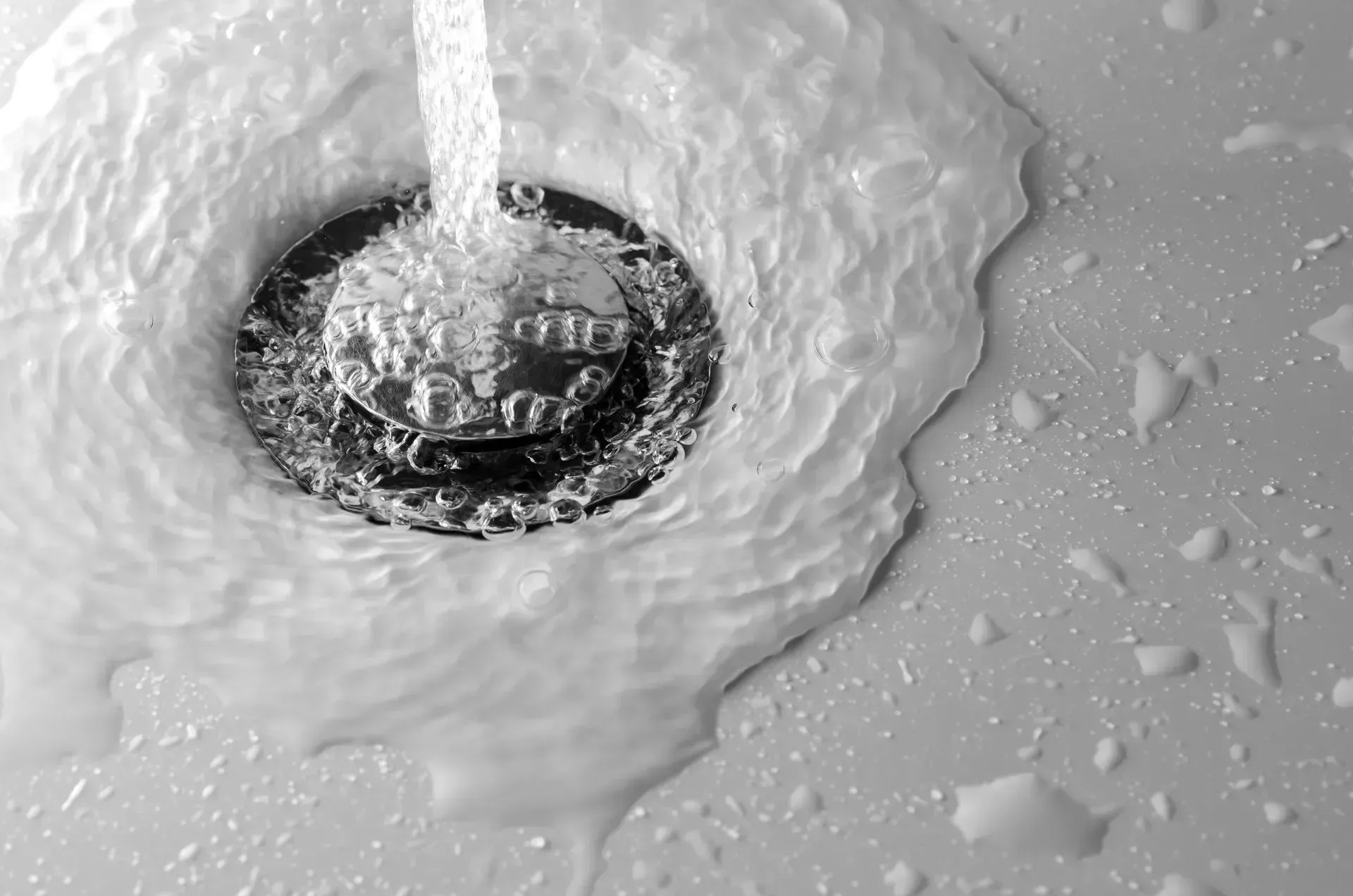 Water pooling around a slow draining sink drain in a Bakersfield home