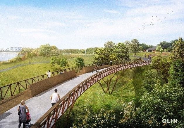 Rendering of a pedestrian bridge over a natural area; people walk and run; trees and a river in the background.