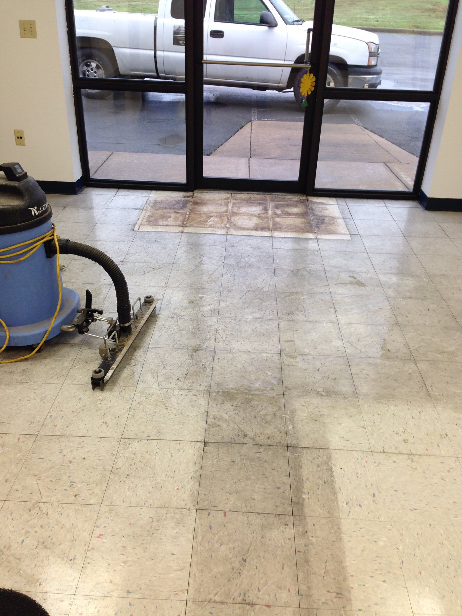 Before photo of a dirty office floor needing commercial cleaning