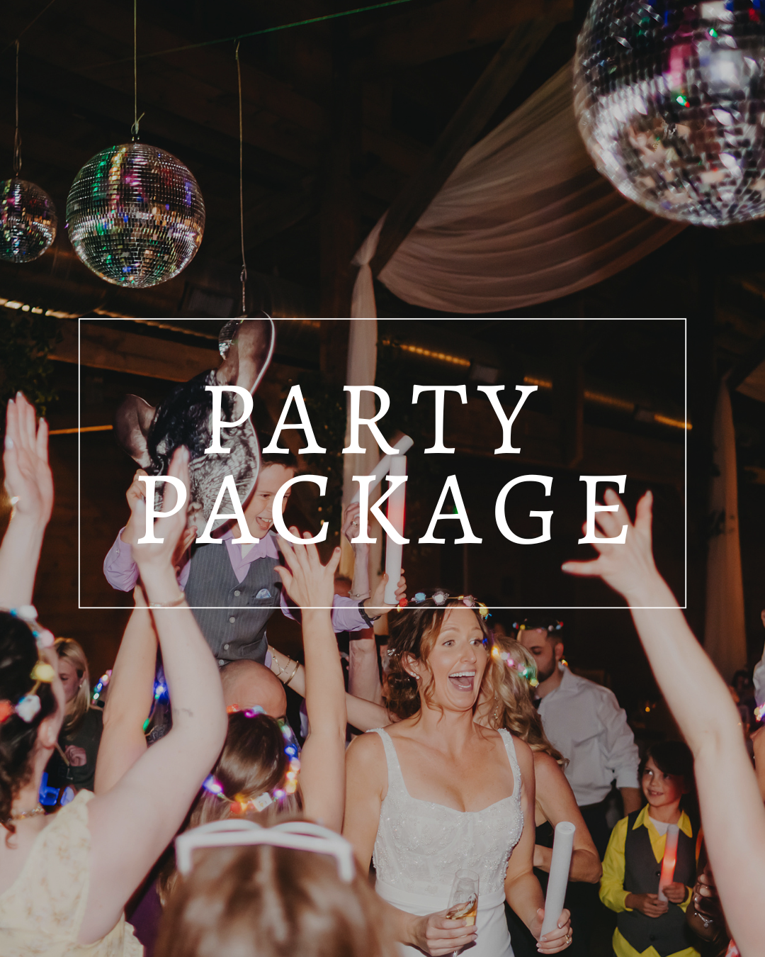 A joyful group dances under disco balls in a dimly lit event space, with the words
