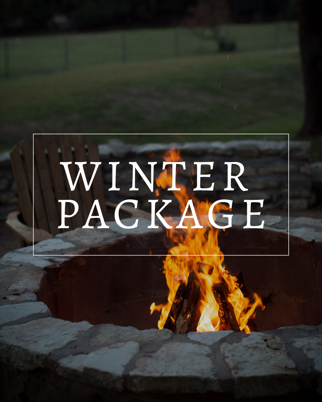 A stone fire pit with a bright, crackling fire at dusk, overlaid with the text