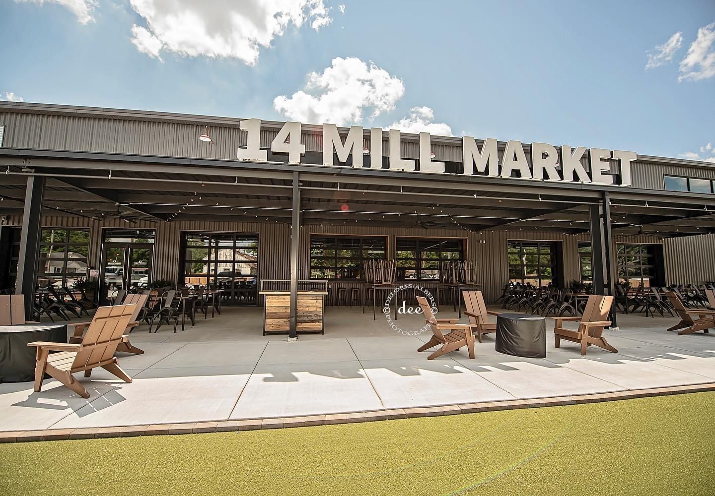 A large building with a sign that says 14 mill market