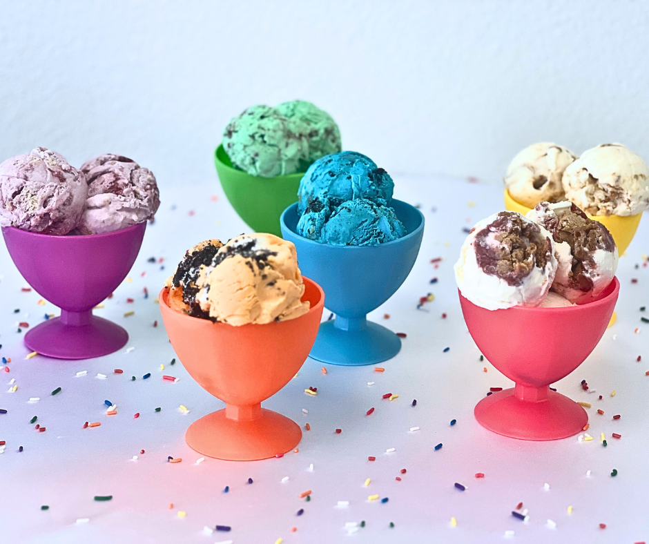 A variety of different flavors of ice cream in colorful cups
