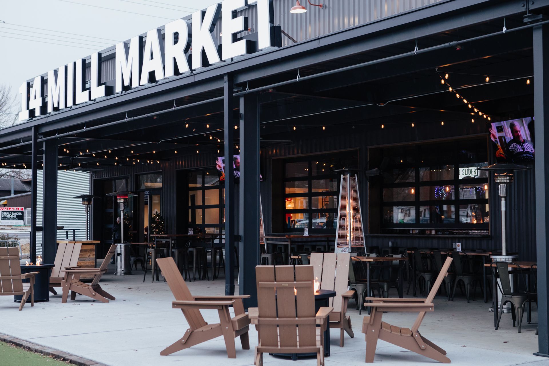 A restaurant with a lot of chairs and tables outside.