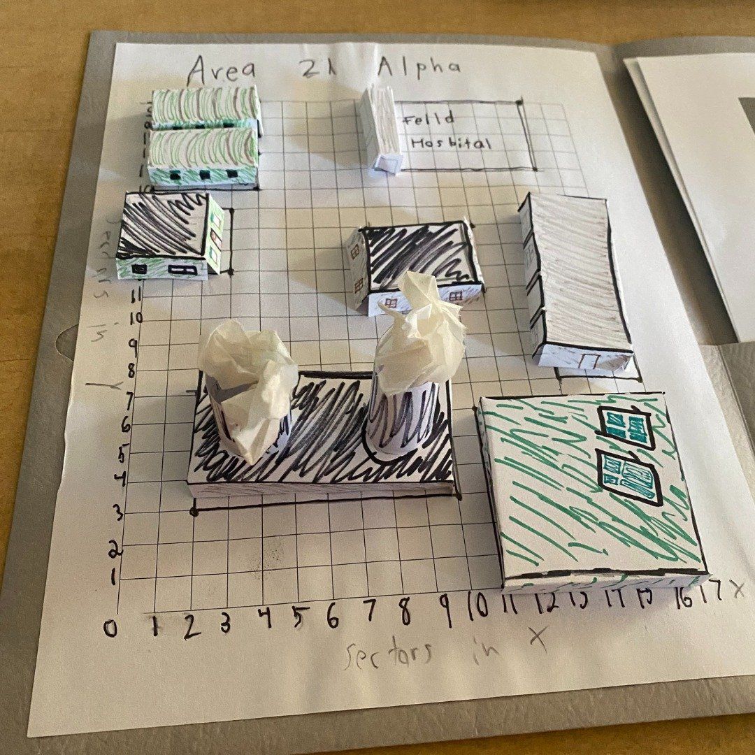 A drawing on a piece of paper that says area 21 alpha