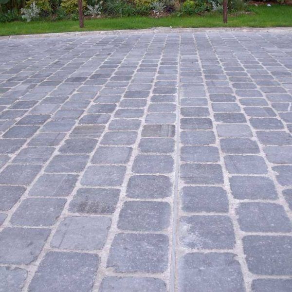 Blue-grey Belgian blue stone setts laid in rows on a driveway in Sheffield