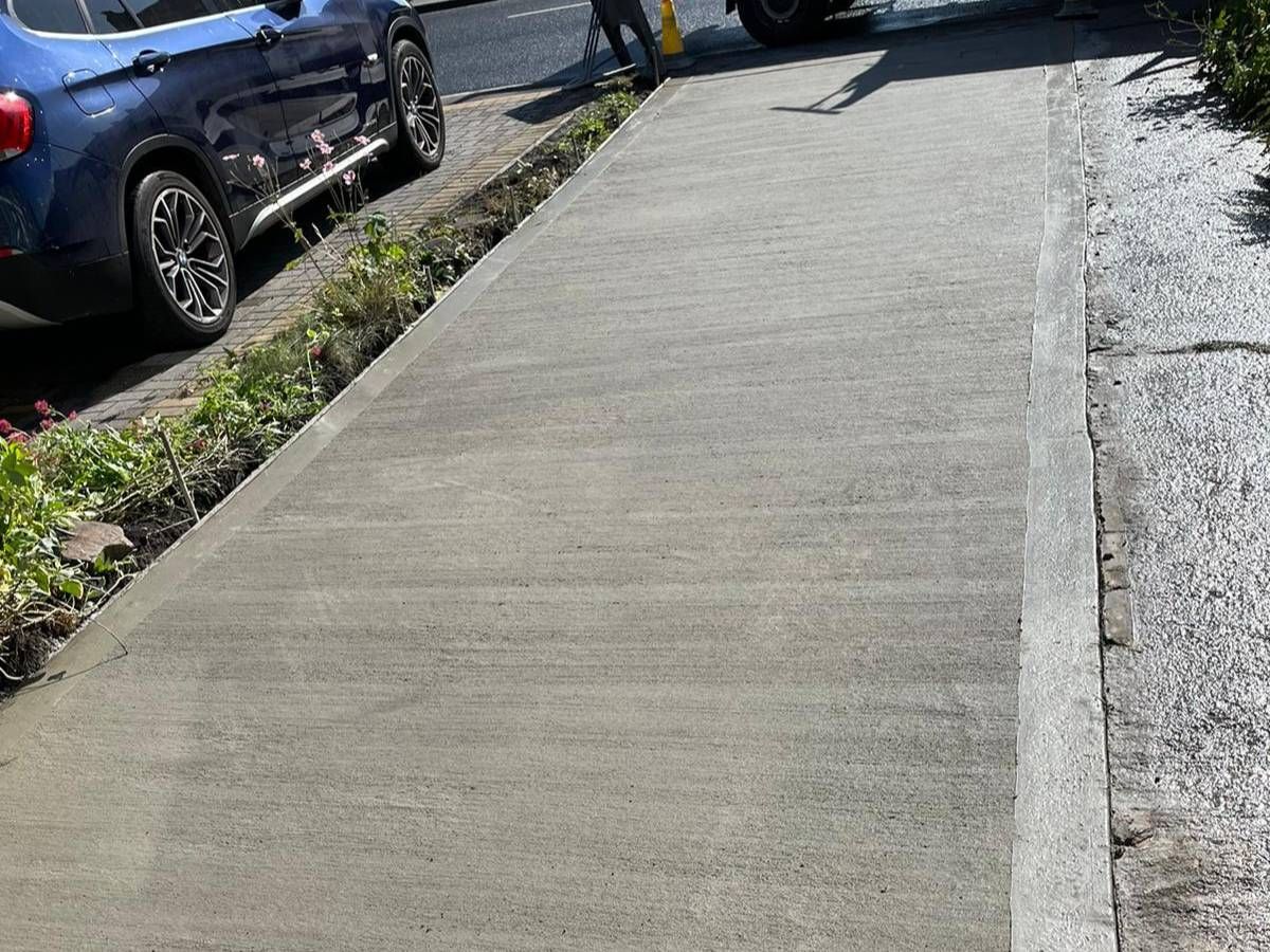 30m² brushed concrete driveway laid alongside a parked car in Woodhouse, Sheffield