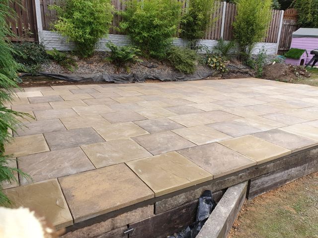 53m² buff Indian stone patio edged with timber sleepers in Heeley, Sheffield