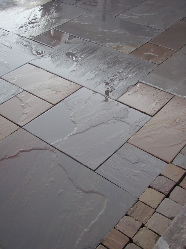 Dark grey Indian sandstone patio in a Sheffield garden