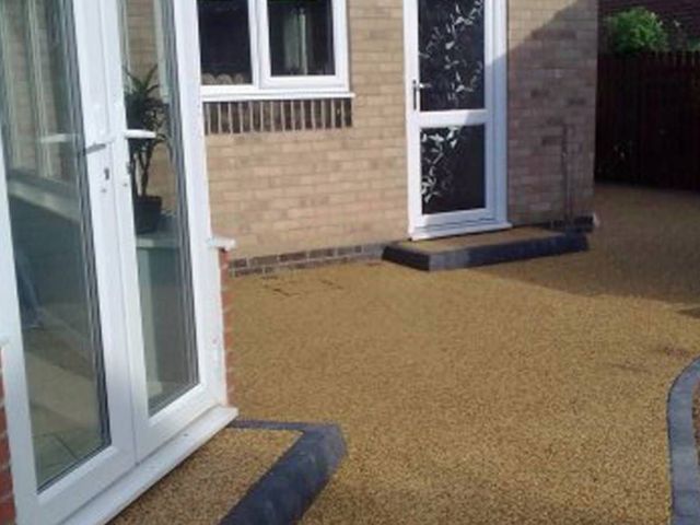 Buff resin bound patio outside French doors in Sheffield