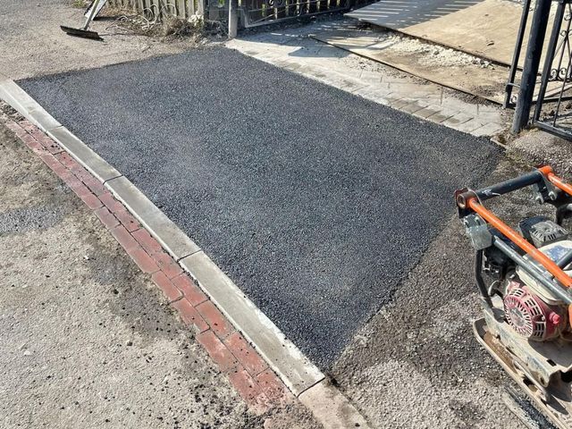 Extended tarmac driveway meeting a new dropped kerb in Sheffield