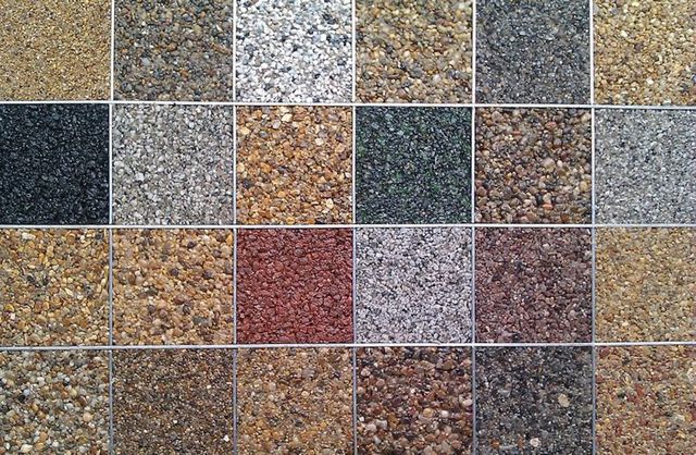 Grid of resin bound aggregate colour samples, from greys and buffs to reds and black