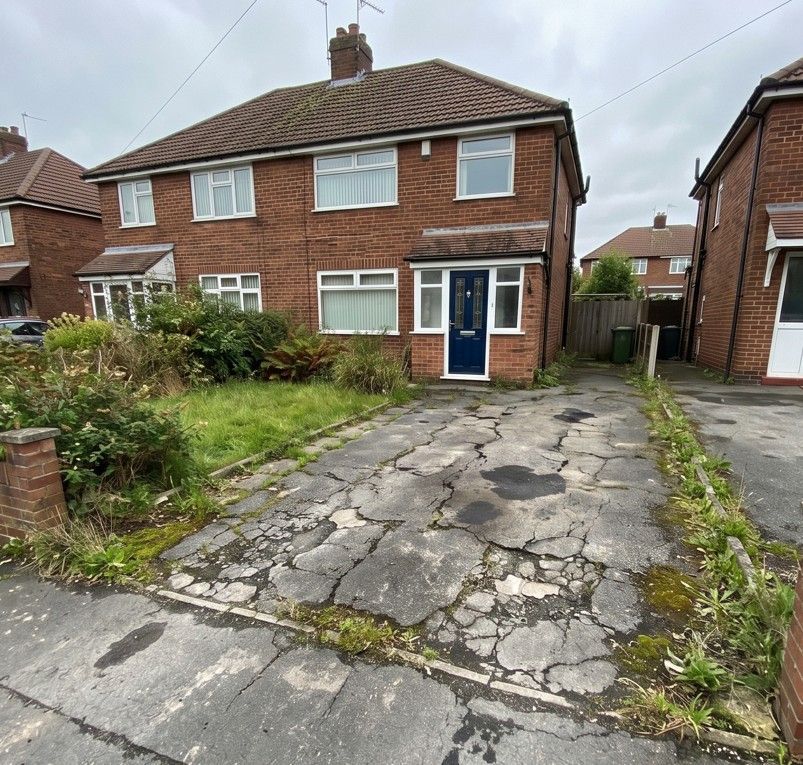 Old deteriorated tarmac driveway before replacement in Woodhouse Sheffield