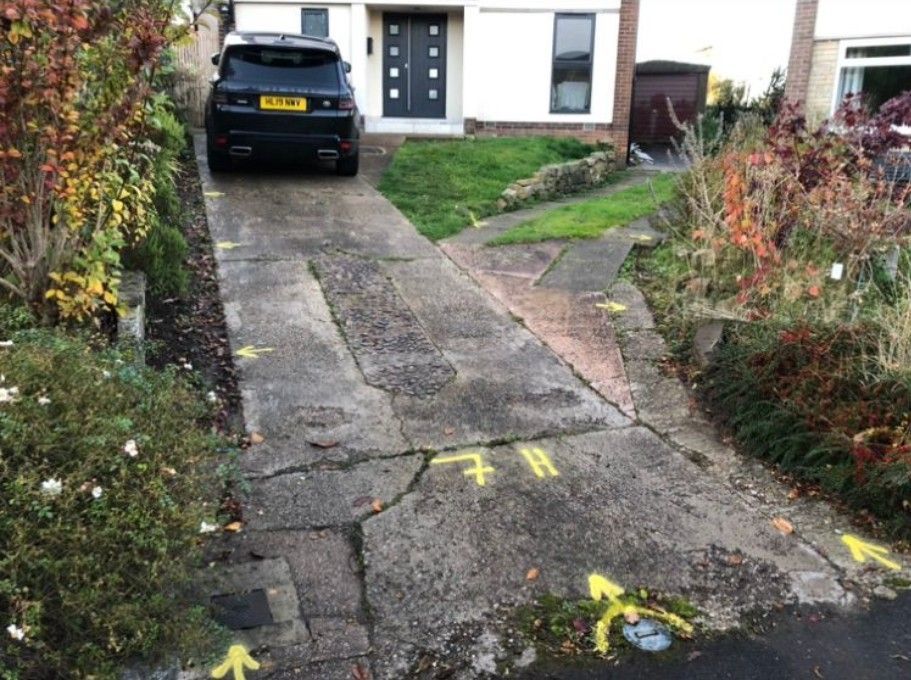 before installing new walls and removing existing concrete driveway