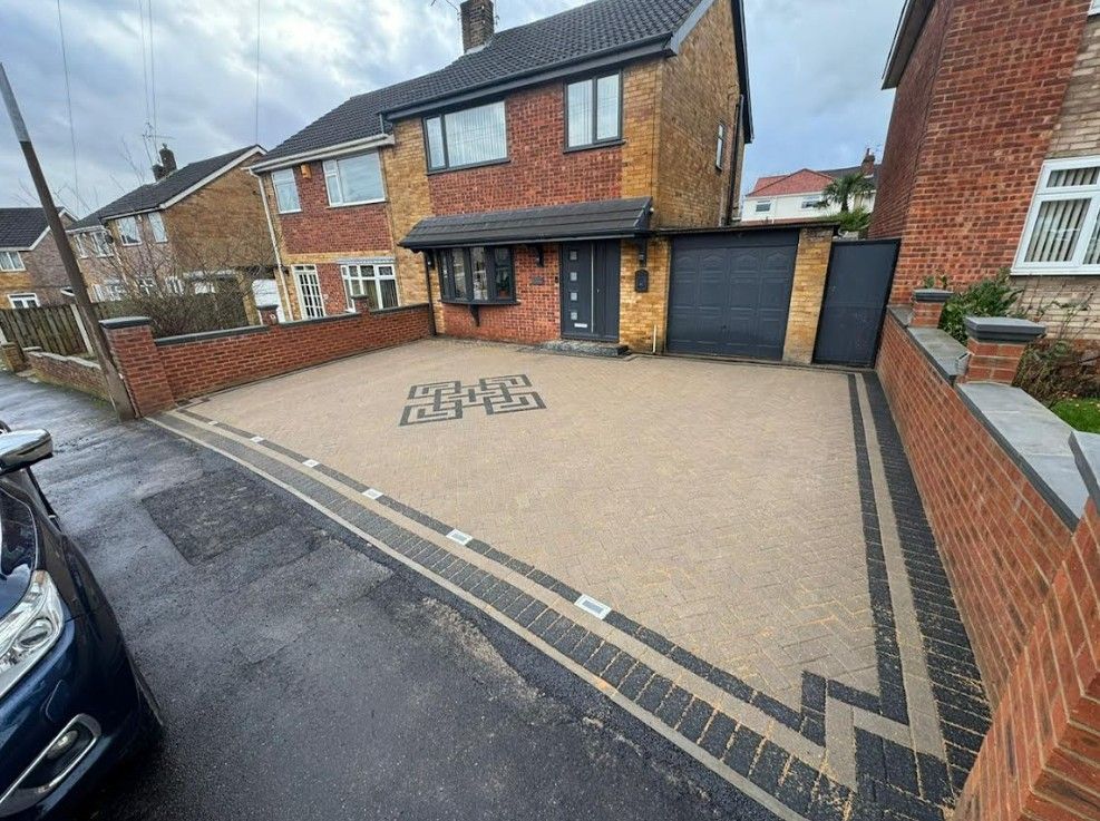 Beige and charcoal block paving driveway