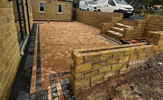 Herringbone Buff Block Paving with two-tone Stretcher Bond edging installed in Crosspool, Sheffield