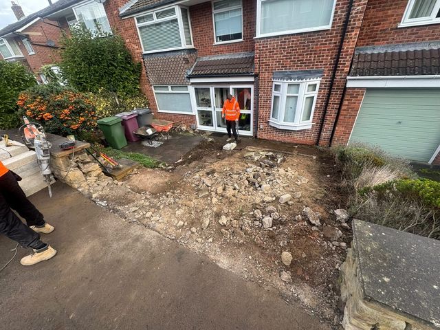 Old front garden steps and slabs broken out and excavated for a new driveway in Dronfield