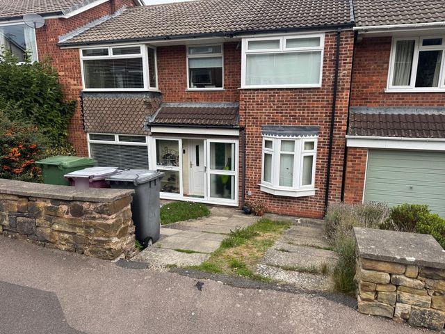 Sloping front garden with old concrete slab steps and paths before a new driveway in Dronfield