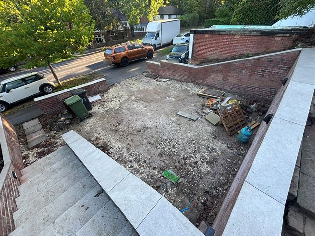 Cleared front garden with rubble and pallets before a new tarmac driveway on Bocking Lane, Sheffield