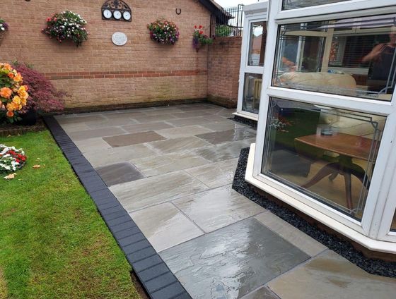 Driveways Sheffield indian stone patio with charcoal block paving edging installed in Sheffield