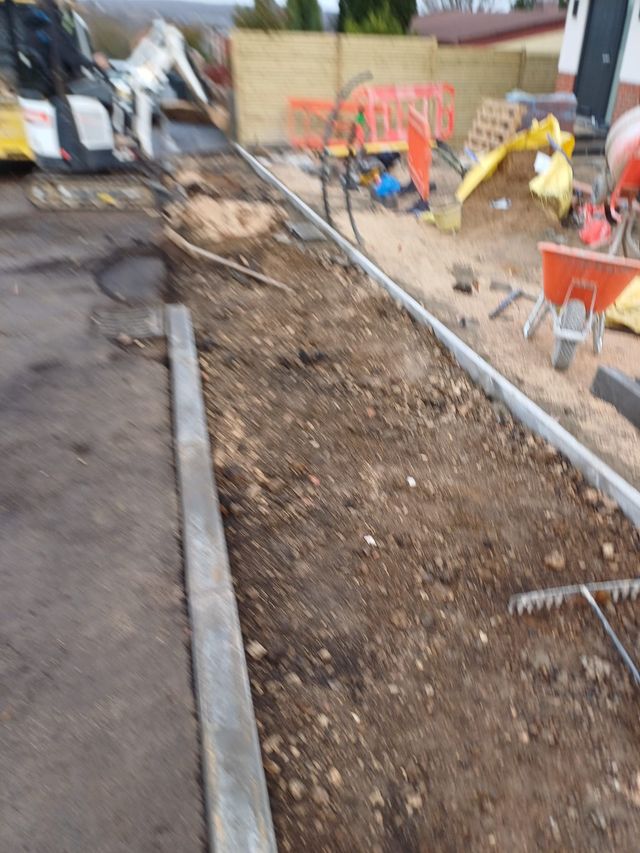 New kerb line set out beside an excavated footway in Sheffield