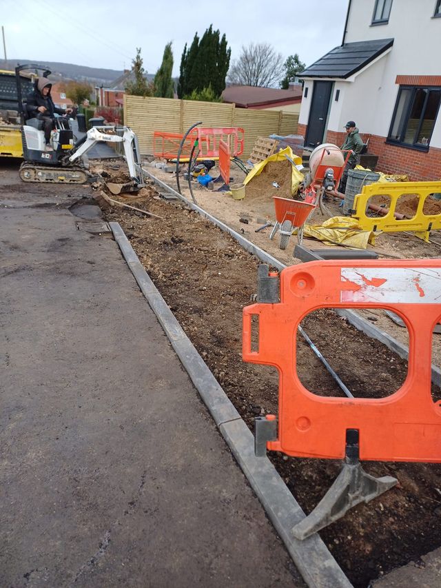 New kerbs laid with safety barriers in place on a Sheffield street