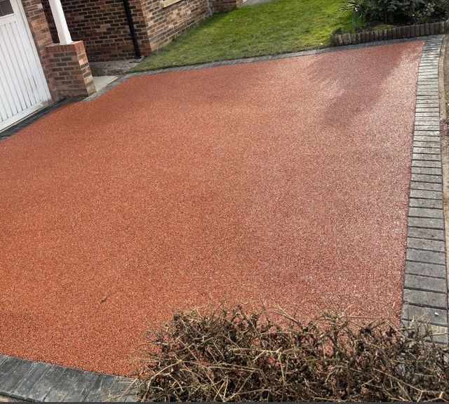 The same driveway resurfaced in red tarmac