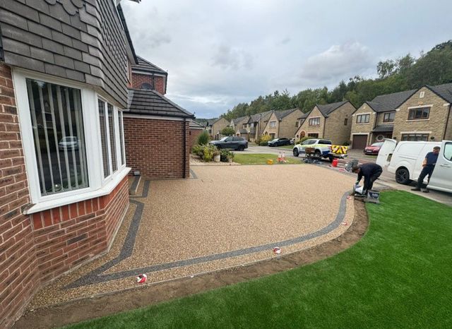 New resin bound driveway curving round the lawn of a house in Oughtibridge