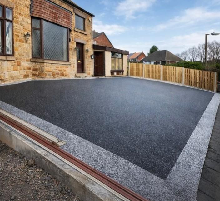 black tarmac driveway with block paved edging