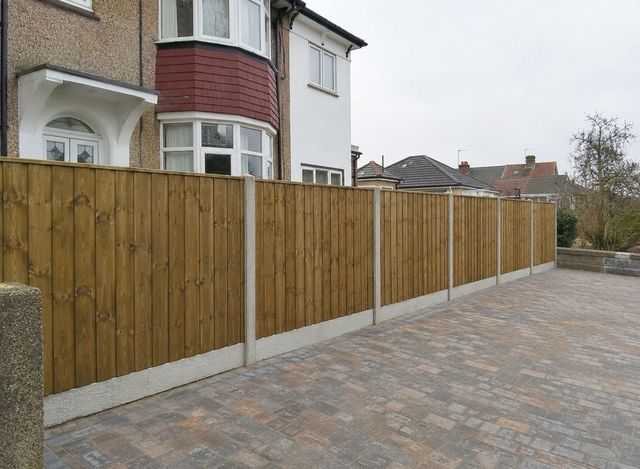 Timber close board fencing alongside a block paving driveway in Sheffield
