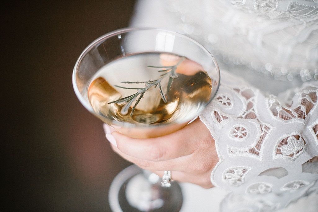 A Woman Is Holding a Glass of Champagne in Her Hand - Lee’s Summit, MO - Top Shelf Bartending Services, LLC