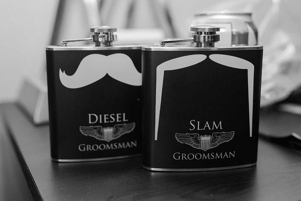 A Black and White Photo of Two Flasks that Say Diesel and Slam Groomsman - Lee’s Summit, MO - Top Shelf Bartending Services, LLC
