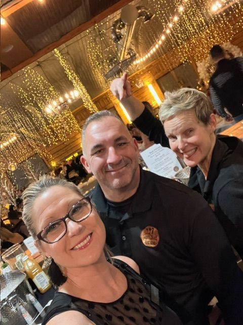 A Man and A Woman Are Standing in Front of A Bar - Lee’s Summit, MO - Top Shelf Bartending Services, LLC