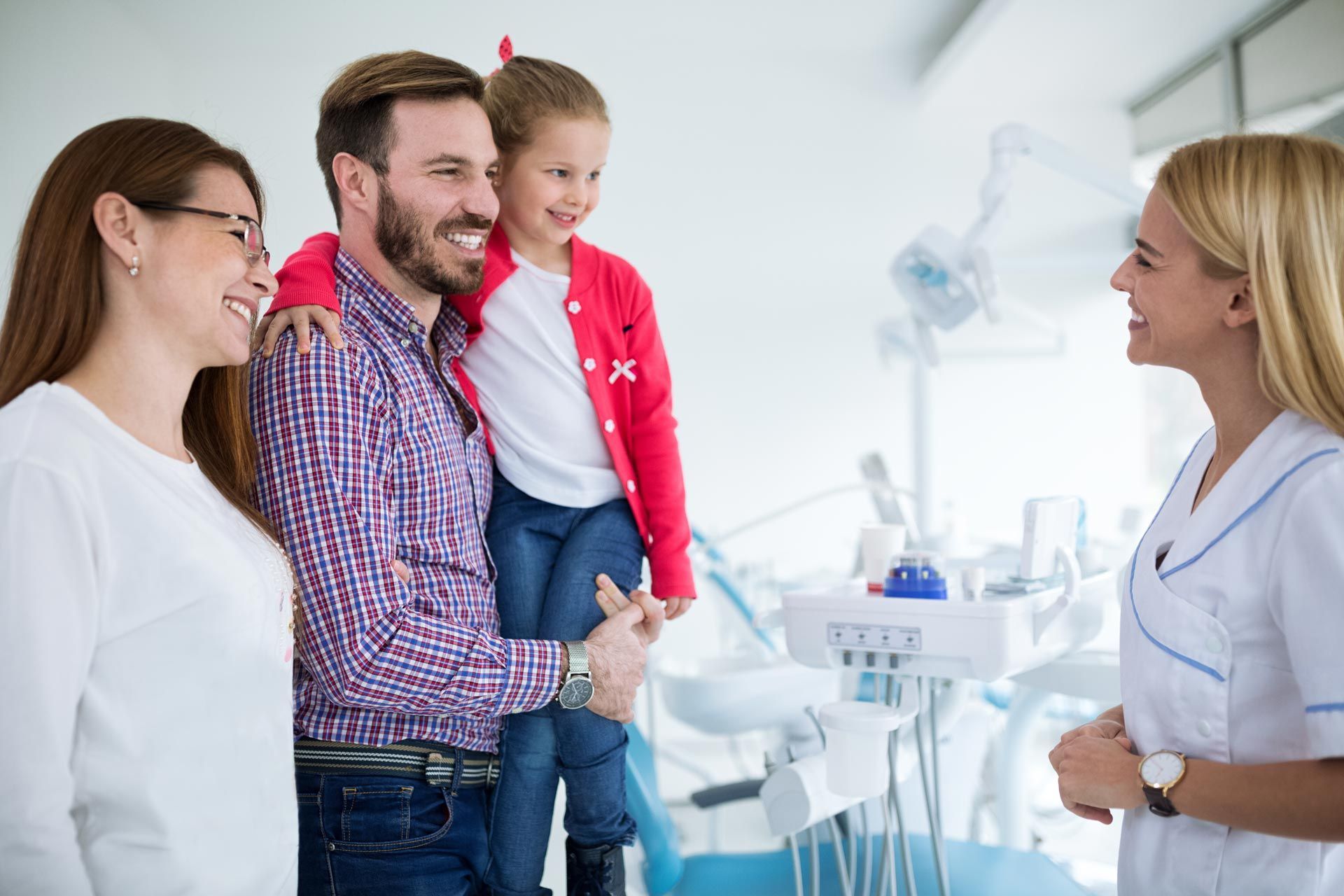 A family visits a dental office.
