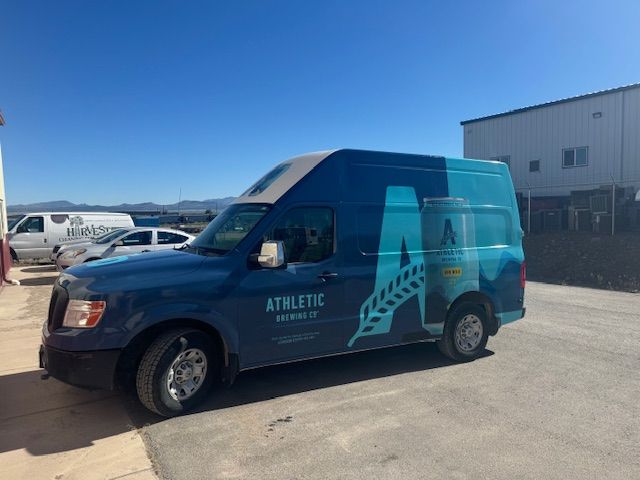 Blue Athletic Brewing van with large 
