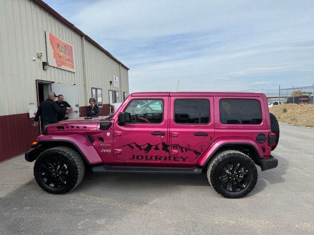 Pink Jeep Wrangler with black wheels and 
