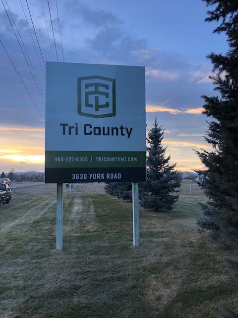 Sign for Tri County business on York Road with logo, phone, and website.