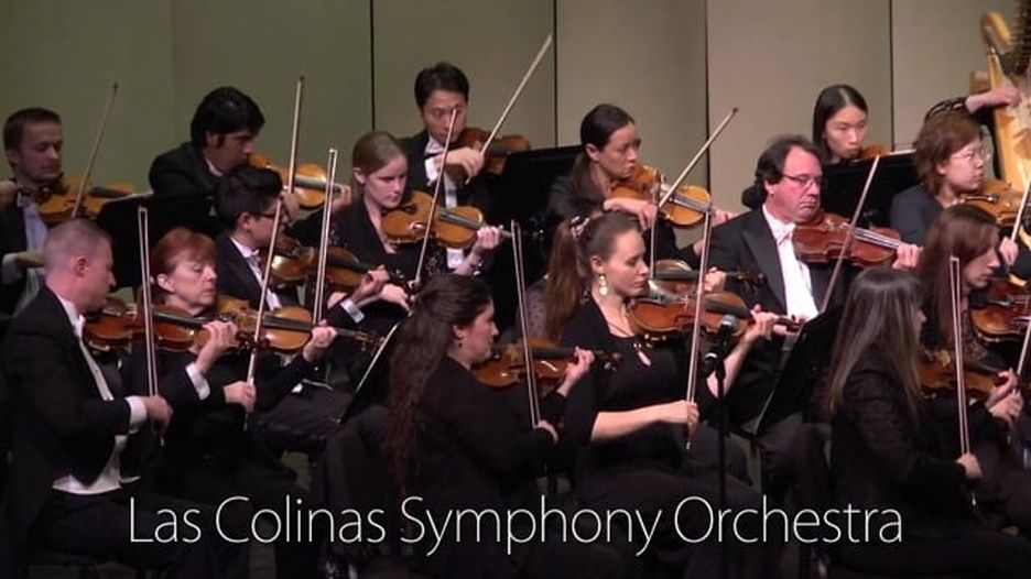 The las colinas symphony orchestra is performing on stage