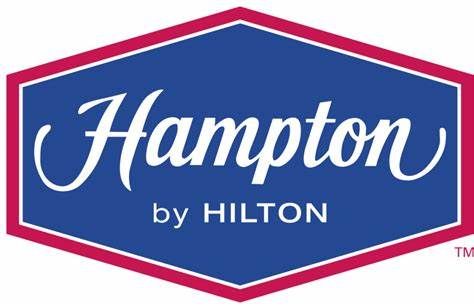 The logo for hampton by hilton is blue and pink.